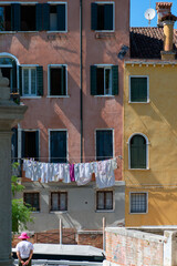 Washing are being dried hung on clotheslines in the streets of ancient Venice