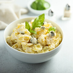Traditional homemade potato salad with gherkins