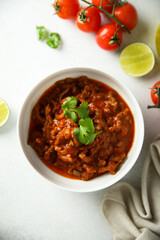 Homemade beef ragout with cilantro and lime
