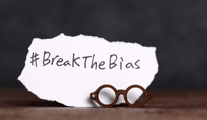 Torn paper with the word ‘BreakTheBias' written on it. Break the bias campaign.
