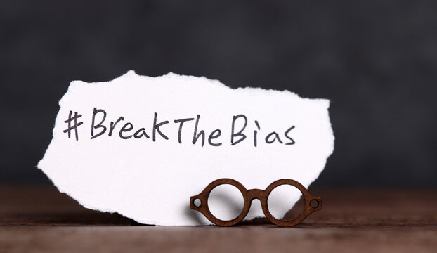 Torn paper with the word &lsquo;BreakTheBias' written on it. Break the bias campaign.
