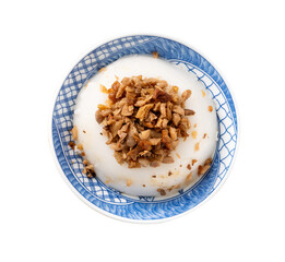 Taiwanese savory rice pudding Wa gui with chopped dried radish and soy sauce isolated on white...