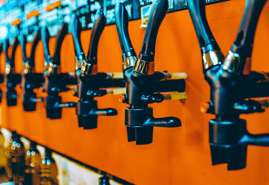 various types of craft beer tap are served in the beer store or bar. taproom