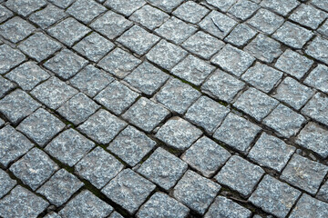 Road or foot path stone surface. Abstract texture for design. Rough stone surface. Traditional construction material