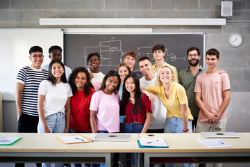 Portrait of a group of students in class looking at the camera. Young people of different...