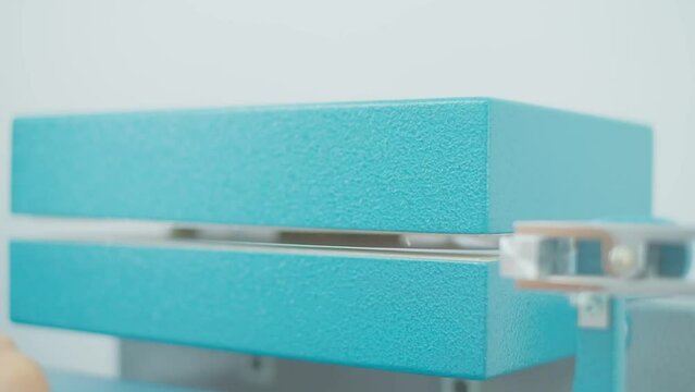 Polymer thread for plastic sack bags is installed to strength test machine, slow motion