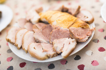 cold cuts of different types of cooked meat on plate