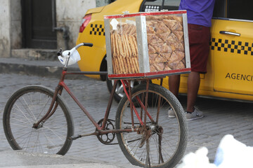 Basket of Chiviricos, (fried dough) coated with sugar in little paper cone bags. They are a popular...