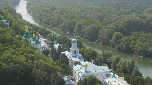 Svyatogorsk Lavra, Donetsk region, Ukraine. A beautiful old monastery is located in the valley of the Seversky Donets River on a mountain around the green foliage of trees