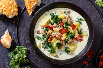 Zuppa Toscana,Tuscan Soup in black bowl, top view