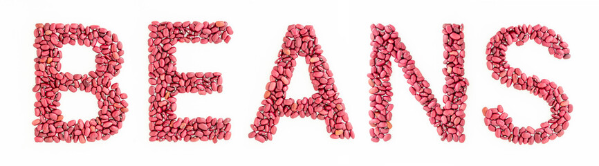 Word beans from red kidney beans on white background. Recipe caption or title.