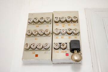 Old electrical fuse box in the house. Old ceramic fuses in building. 
