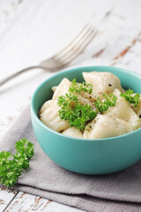 Russian national dish pelmeni served in a plate