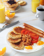 Traditional British breakfast with sausages and beans