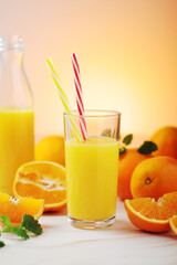 Oranges and orange juice in glasses