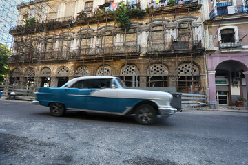 Street scene with old car on rainy day in Havana,Cuba