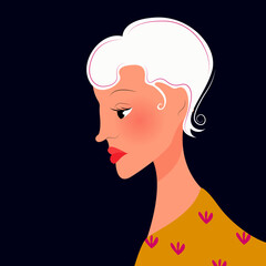 woman with white hair in profile in a yellow sweater