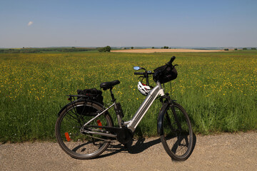 Summer landscape with an e-bike on the way
