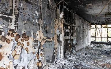 Irpin, Ukraine - May 22, 2022: an interior view of a burned-out house with a charred room, as a...