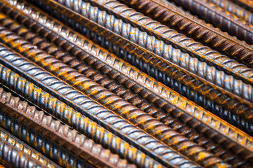 Construction steel rods or bars work reinforcement in conncrete structure of building.Background texture of steel rods used in construction to reinforce concrete