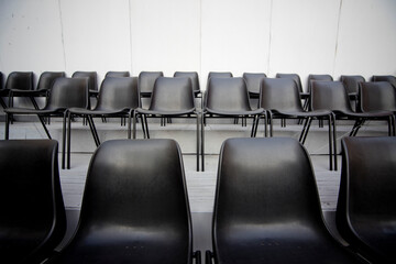 Fototapeta premium lined up chairs of various types used for outdoor theater