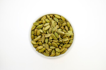 Cardamom on a white background. Pile of Indian Aromatic Spice