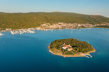Aerial view of Kosljun monastery with Punat town in the background, Krk island, Croatia - obrazy, fototapety, plakaty
