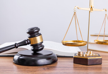 Judge's hammer and scale on the table, legal issues