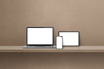Laptop, mobile phone and digital tablet pc on brown wall shelf. Horizontal background