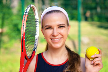 Professional girl athlete playing tennis on court. female player with racket, ball near net outdoor. healthy sport active lifestyle. lady with ceramic braces align bite teeth