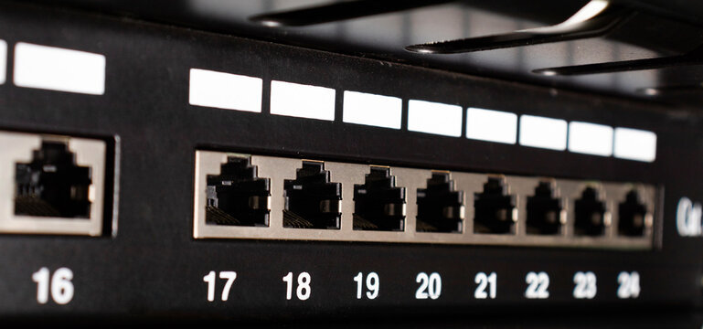 Closeup view of patch panel ethernet ports. Network engineering concept