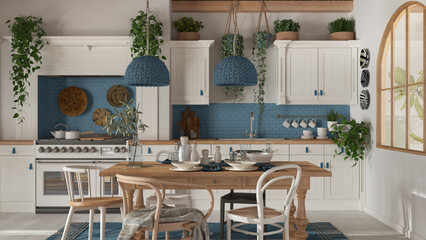 Dining table and kitchen in wooden scandinavian boho style. Table setting in white and blue tones. Country bohemian interior design