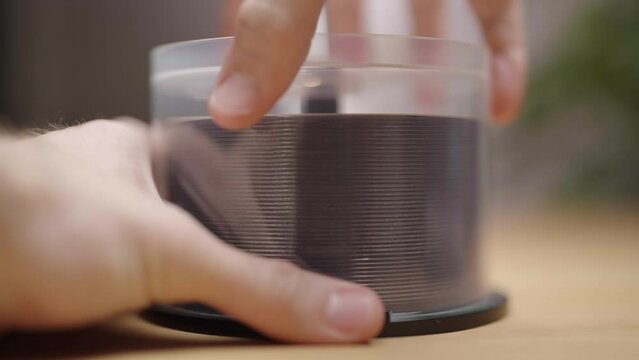 Opening big cake of writable DVD or CD media packaging 4K