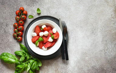 Italian appetizer caprese. Classic caprese salad with tomatoes and mozzarella