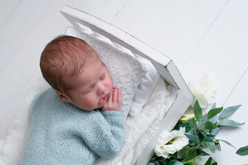 Lovely newborn resting on pillow. sleeping newborn baby boy