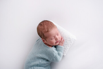 Lovely newborn resting on pillow. sleeping newborn baby boy