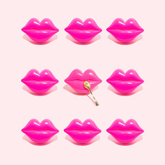 Creative pattern of pink kiss lips with golden spoon isolated on a white background. Sexy sensual female lips. Concept of beautiful kiss, tasty food or sweet desserts.