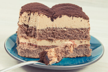 Tiramisu cake with different layers. Delicious dessert for celebrations