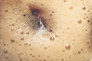 foam background when pouring a drink. Close-up.