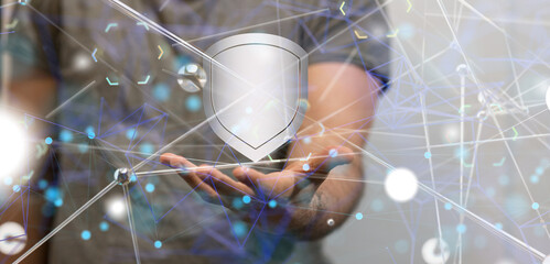 shield protection concept holding in hand