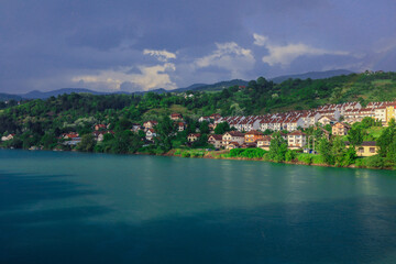 Panoramic View in the Rainy Day to the  Višegrad with the Rainbow over the Drina River, Bosnia and...
