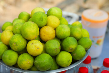 Group of freshly picked harvest lemons in market