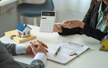 The sales representative offers a home purchase contract to purchase a house or apartment. Or talk...