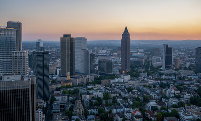 The Skyline in Frankfurt Am Main including the fair Tower("Bleistift") from a rooftop while early sunset and dawn. 