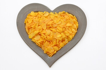 heart shaped corn flakes isolated on white background