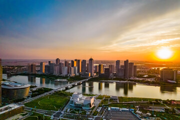 Fototapeta premium Aerial shot of city high-rise in the evening