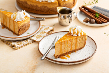 Pumpkin cheesecake with fall spices topped with whipped cream