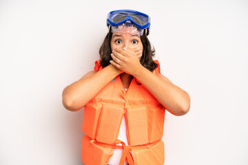 hispanic pretty girl pointing at camera choosing you. life jacket concept