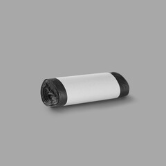 Roll of garbage bags isolated on a gray background. On the roll white copy space.