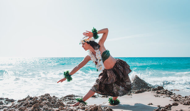 Hula dancer performing hawaii dance. Girl dancing wearing tahiti summer clothes. Miss queen flower crown
